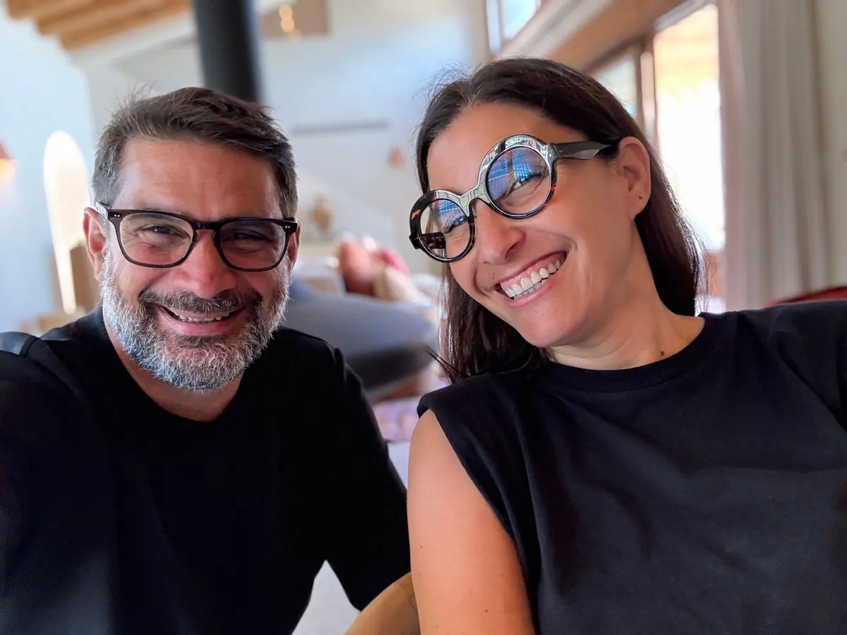 Jean Clauteaux and Jessica Bataille smiling, at home
